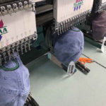 caps being embroidered